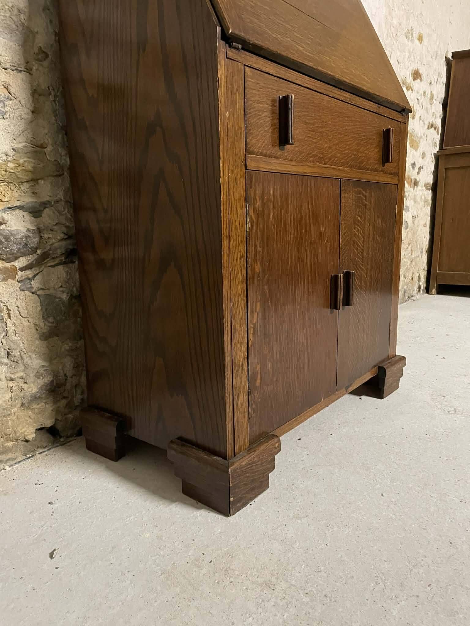 Oak display secretary cabinet with drop-down front, two sections.