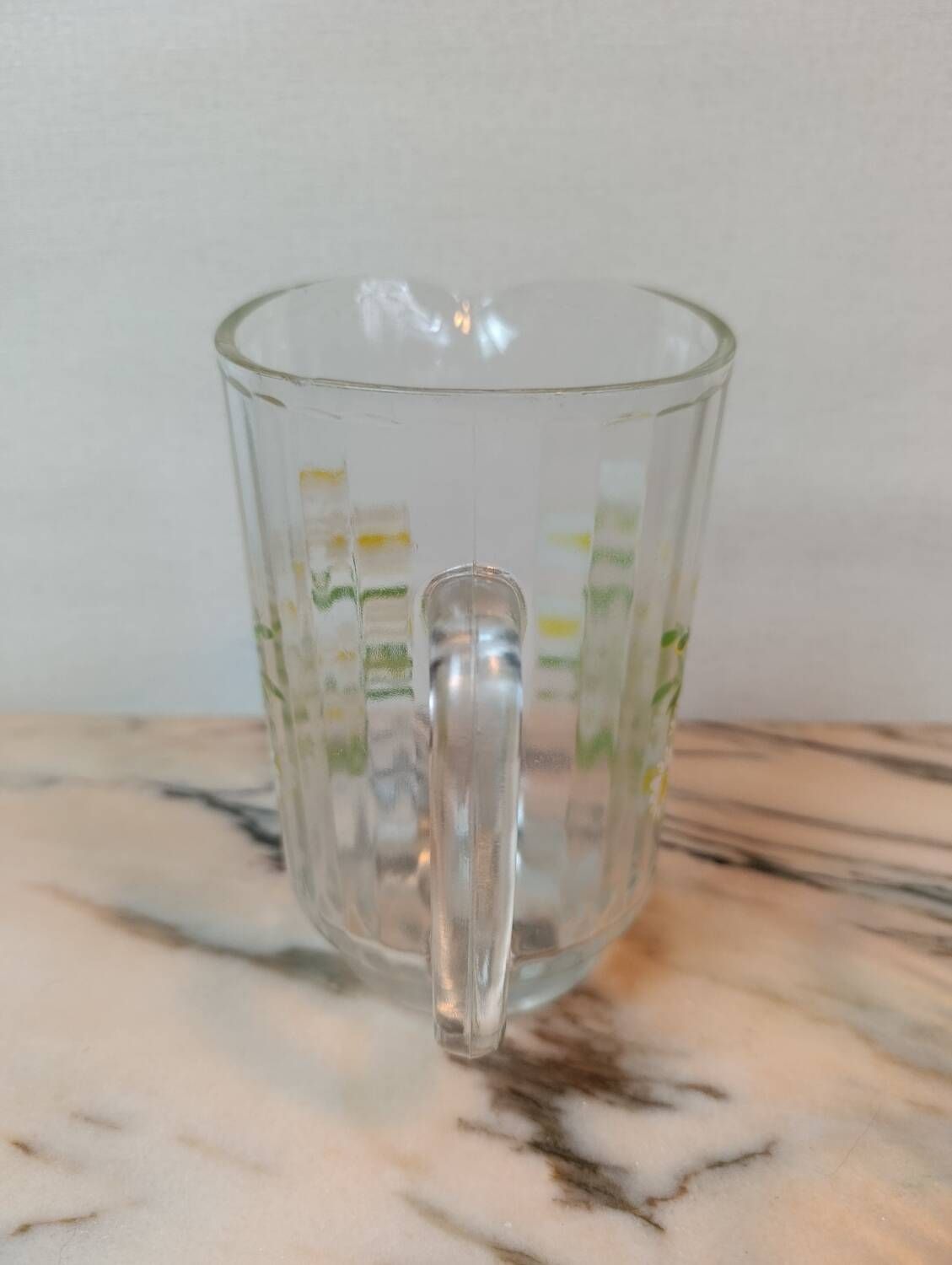 Orangeade service with a jug and six glasses featuring a daisy pattern.