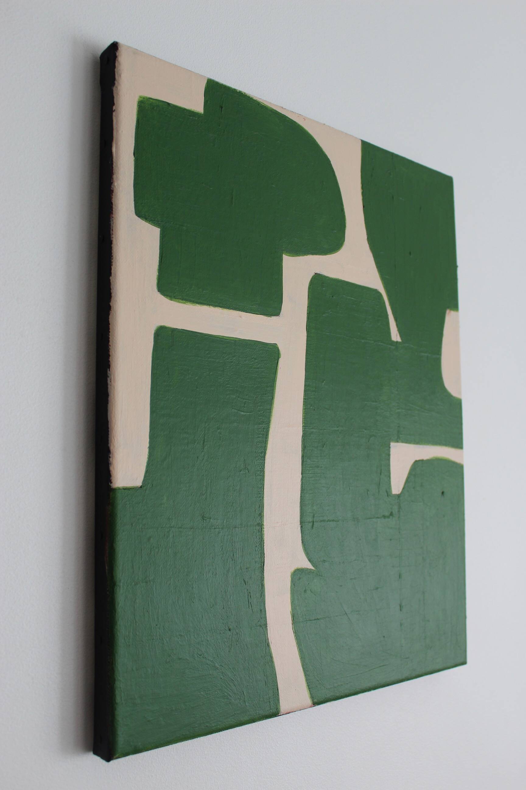 Abstract green art on a beige background.