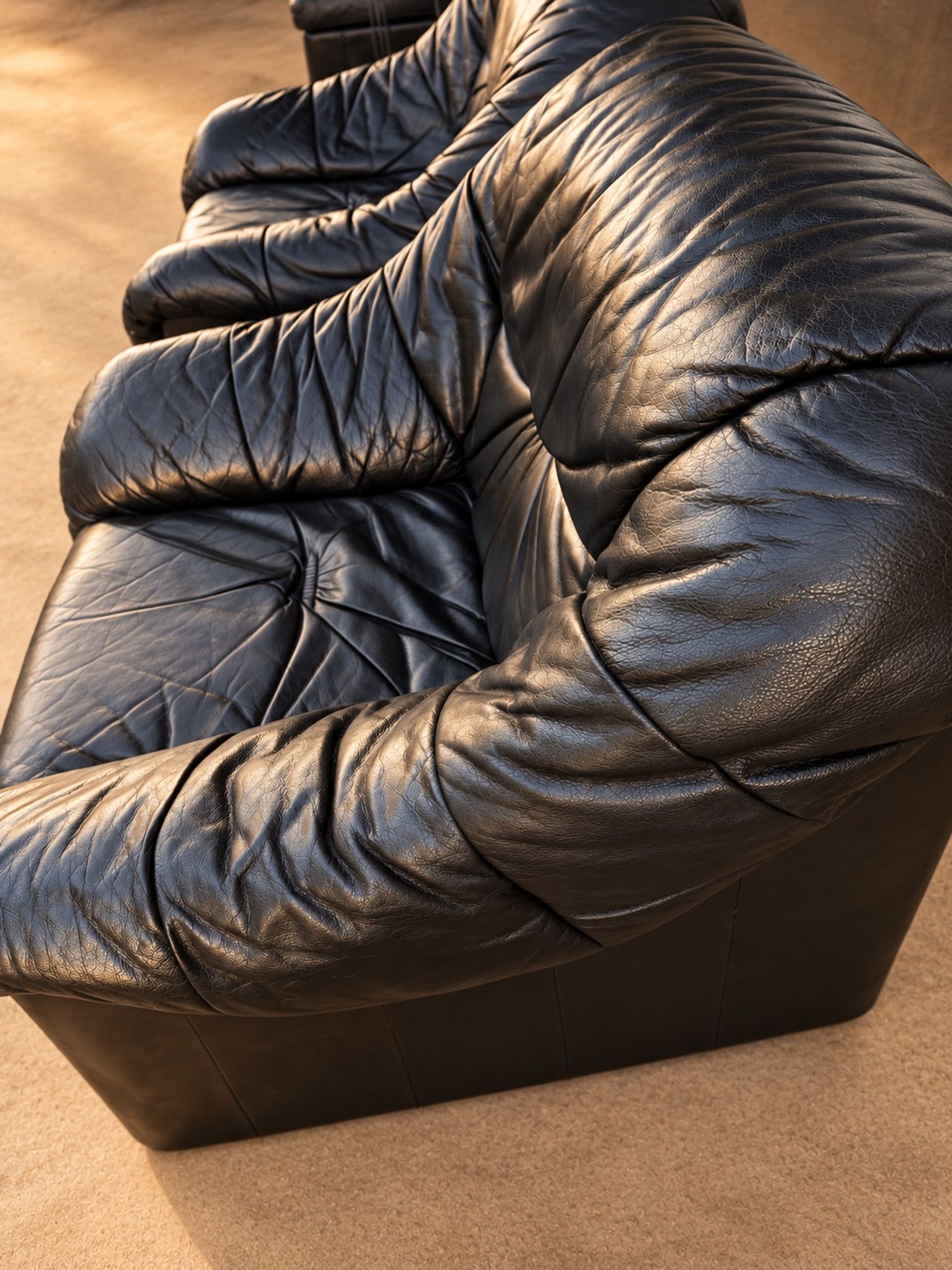 Leather armchairs and matching pouf, Italy, circa 1980