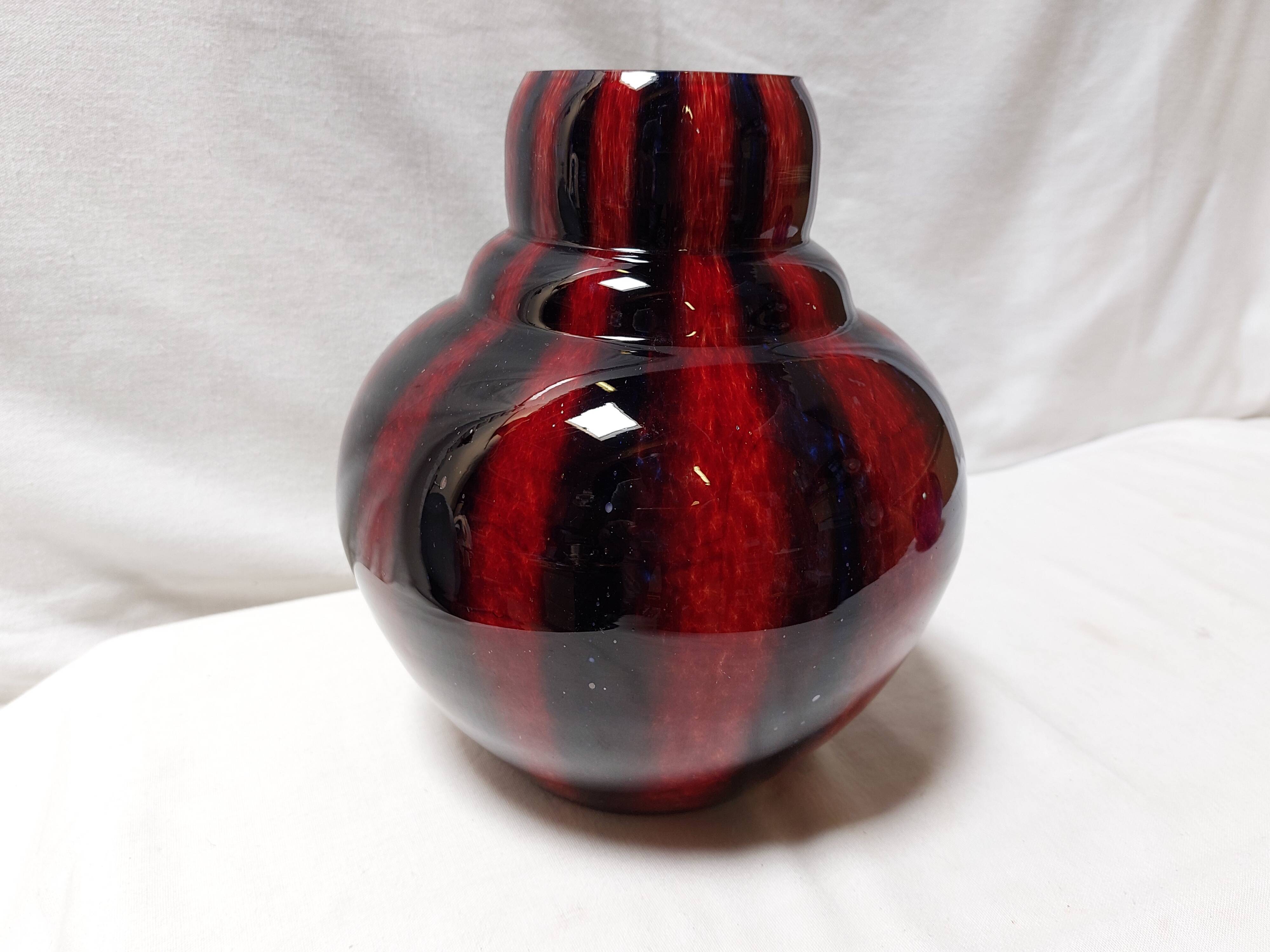 Large vintage blown glass ball vase with red and midnight blue flamed decor