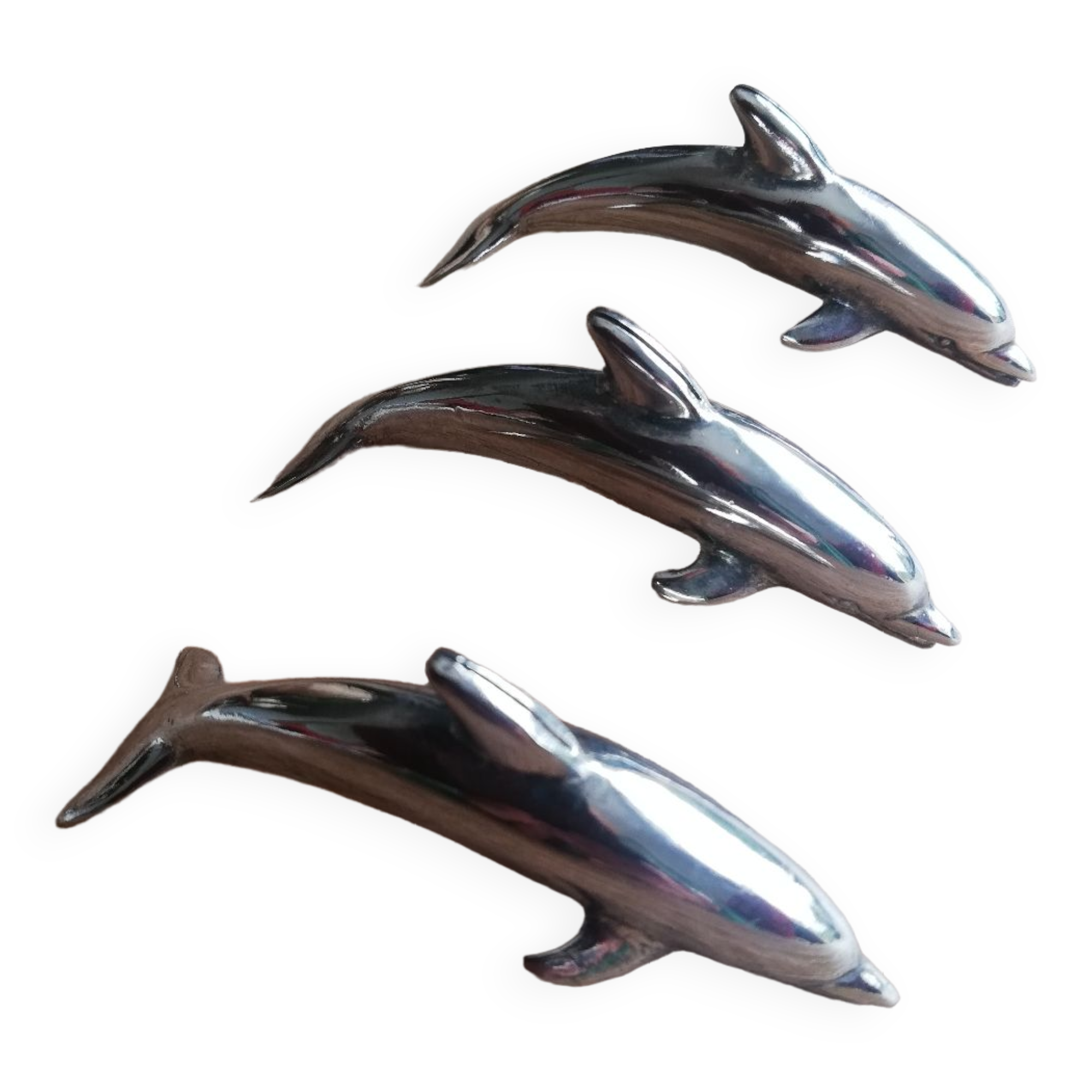 Set of three silver metal dolphin place markers