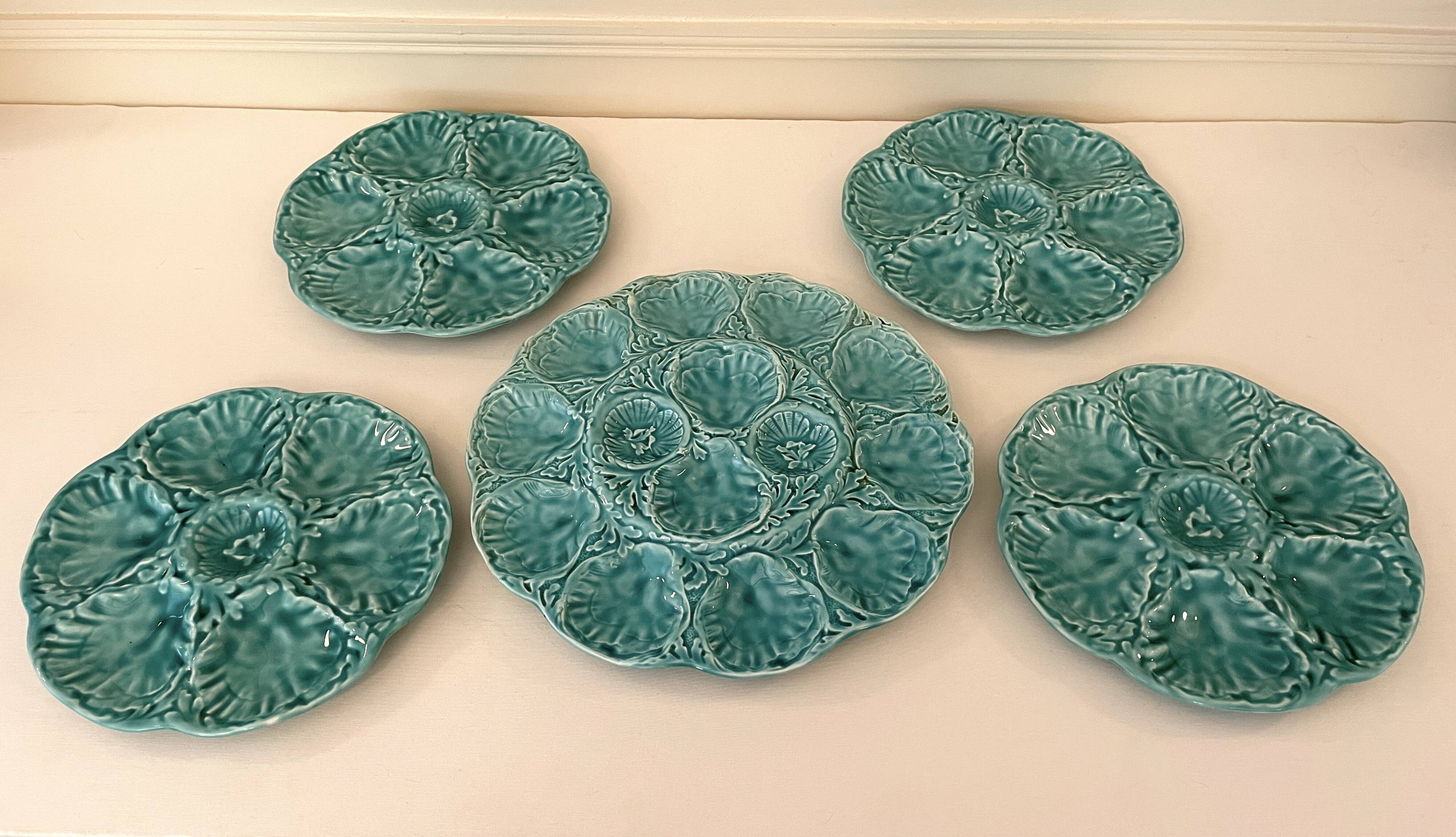Dish and 4 turquoise faience oyster plates from Gien, France.