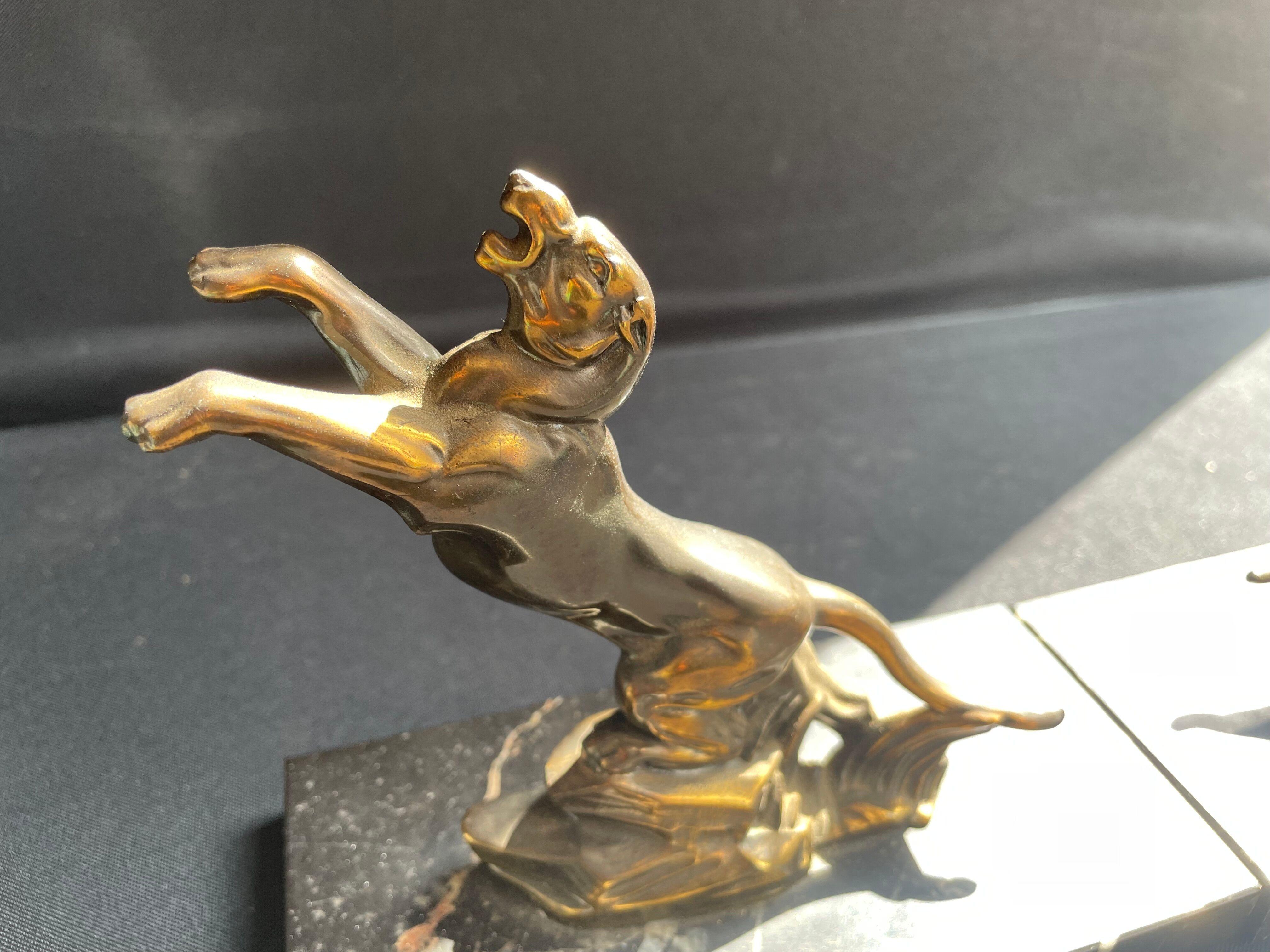 Pair of art deco marble and patinated regulated bookends