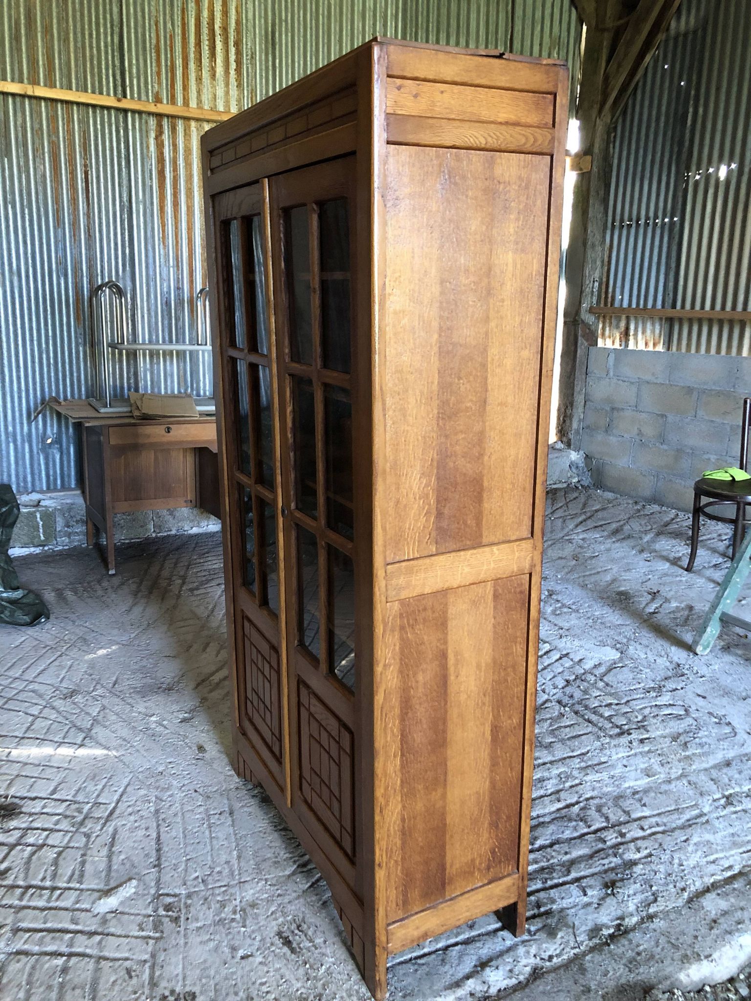Vintage oak bookcase from the reconstruction period with 2 doors with small panes.