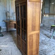 Vintage oak bookcase from the reconstruction period with 2 doors with small panes.