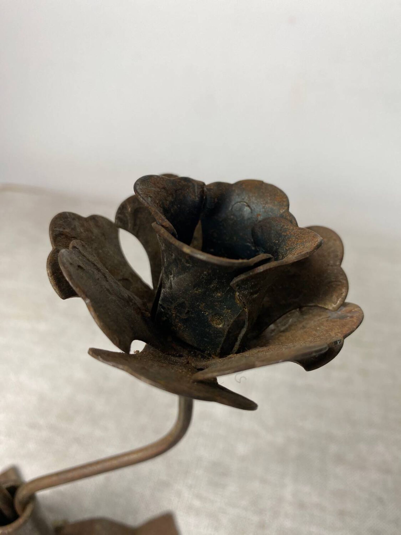 Rose shaped metal candle holder