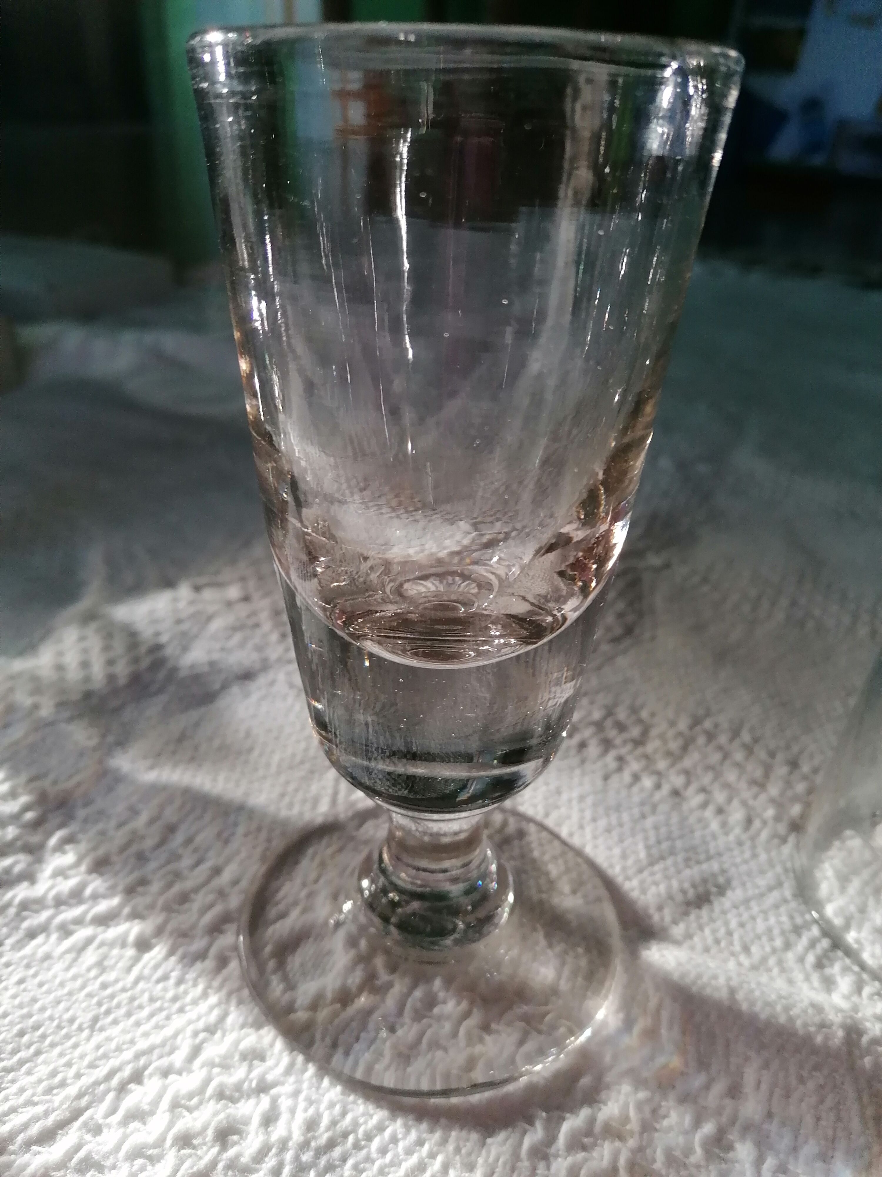 Absinthe service glasses and spoons.
