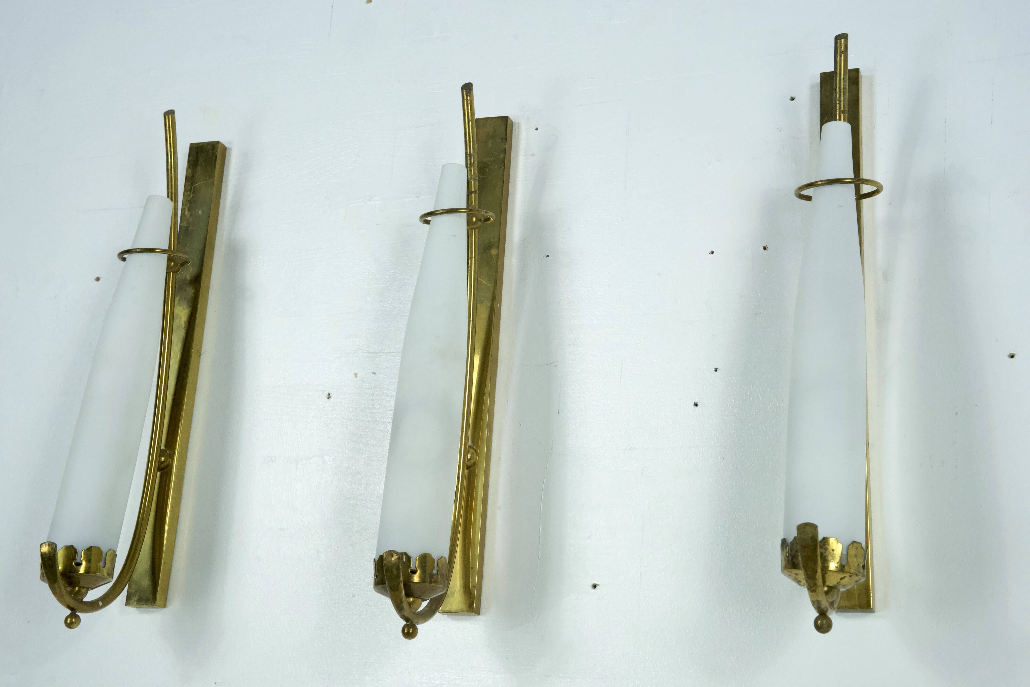 Set of three sconces in brass and triplex opaline glass. Italy 1950s