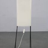 Mid-century modern floor lamp on iron legs with plastic shade and wood accent
