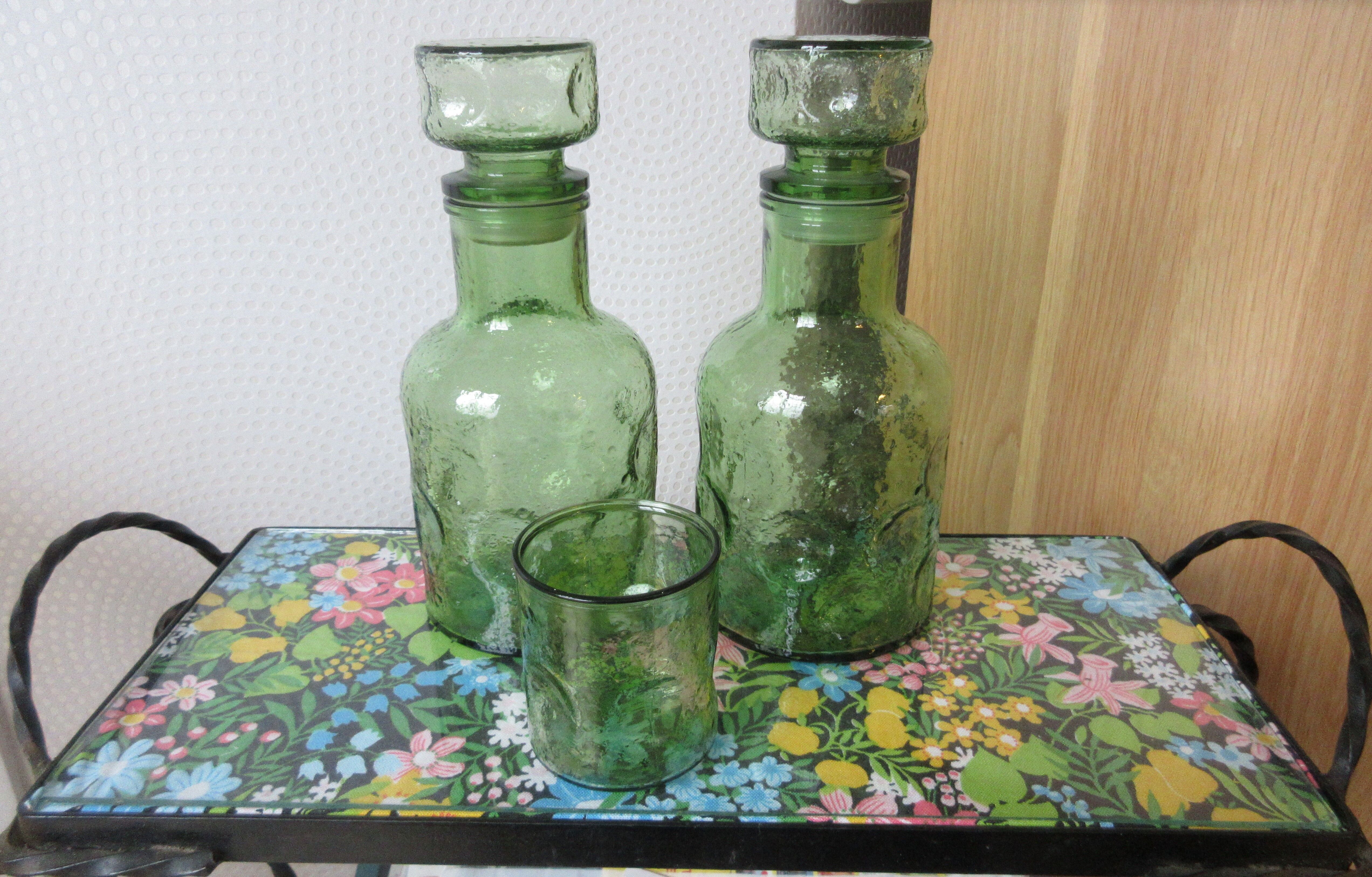 Pair of green decanters and glass