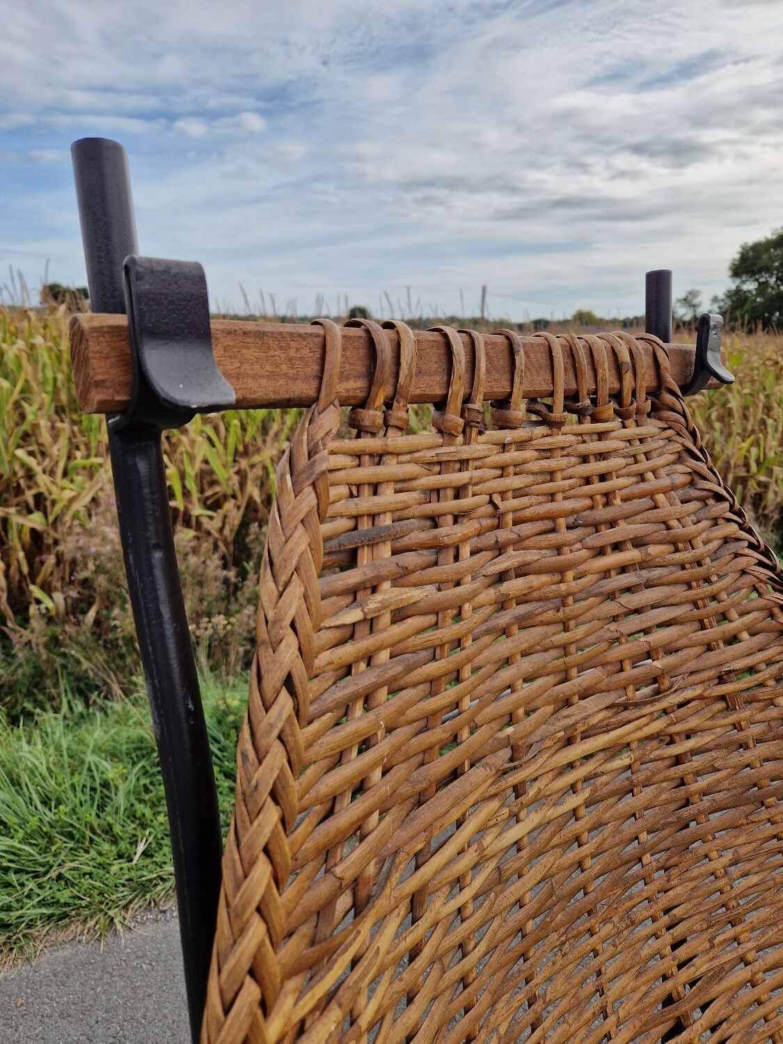 Large vintage metal and wicker armchair