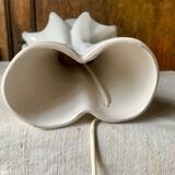 Ceramic table lamp depicting two hands holding a globe, 1980