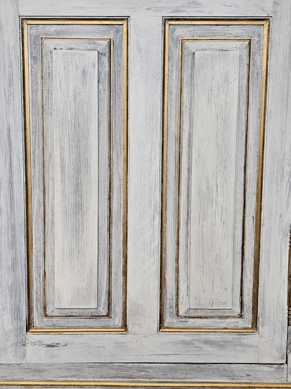 Antique bookcase with a white cerused patina