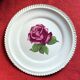 Decorative plate Harker with a red rose in the centre and a 22-carat gold border.