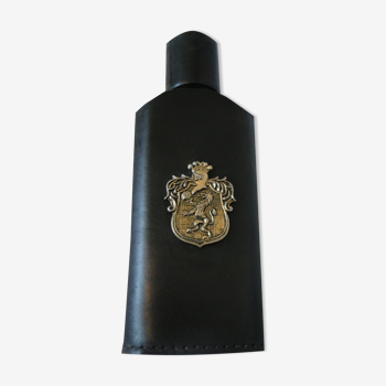 Empty bottle for wiskies or alcohol sheathed in black leather