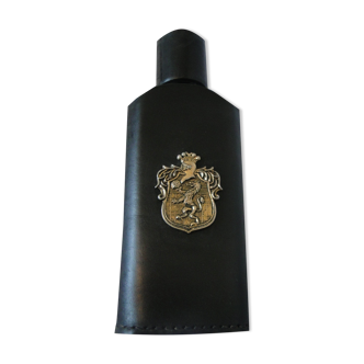 Empty bottle for wiskies or alcohol sheathed in black leather