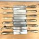 Service de 12 couteaux de table manche en corne blonde