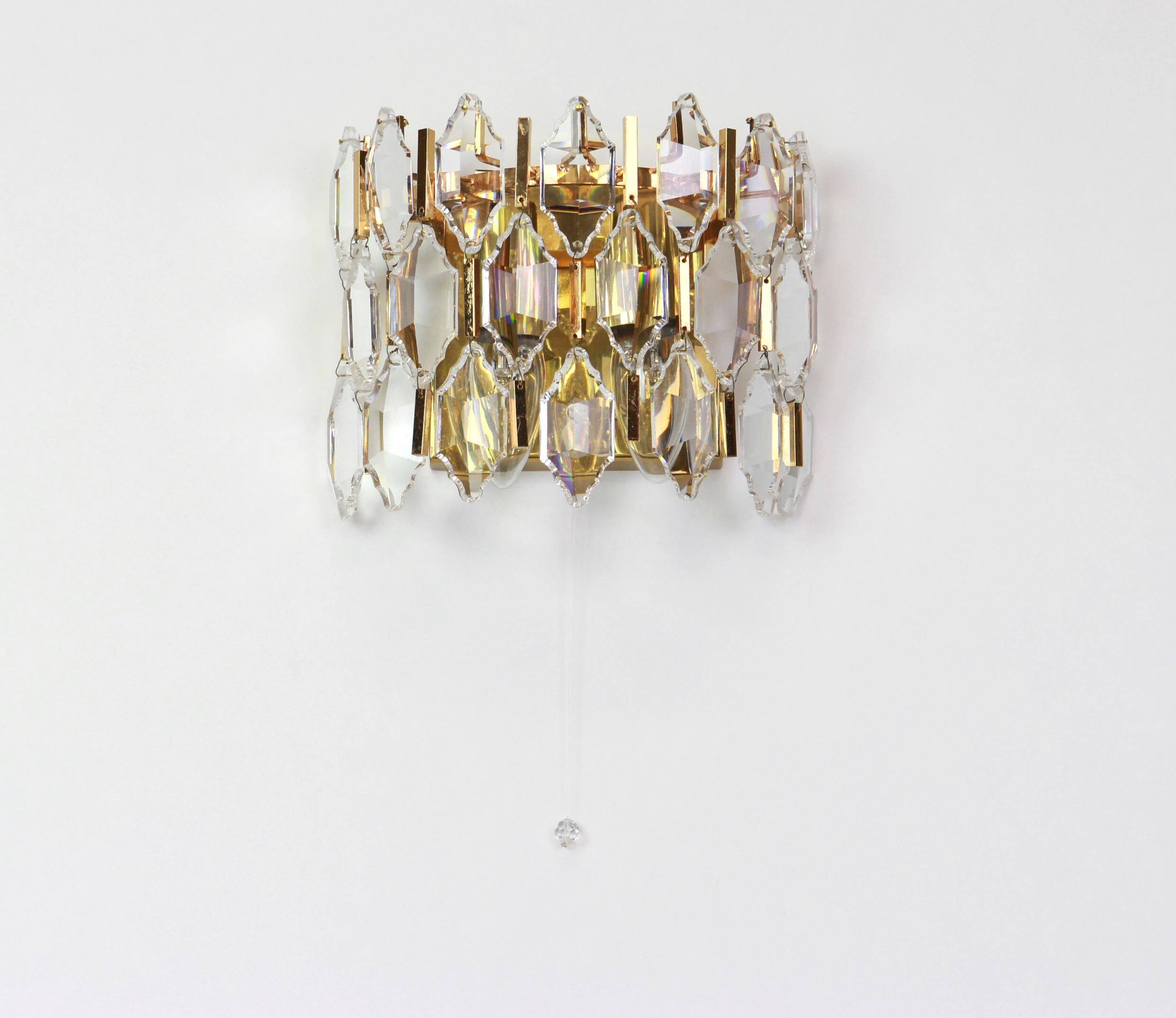 Pair of wall sconces in gilded brass and crystal by Palwa, Germany, 1970s.