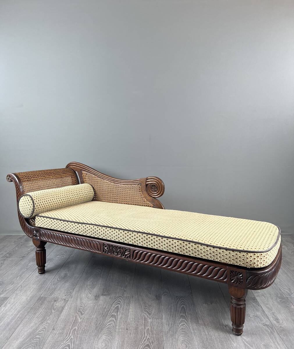 Louis XVI style meridian in carved wood and caning, 19th century.