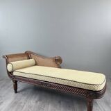 Louis XVI style meridian in carved wood and caning, 19th century.