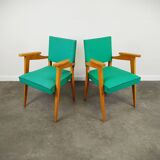 Pair of wood and vinyl armchairs