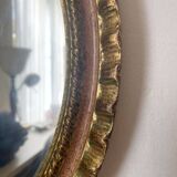 Oval Florentine mirror in powder pink and gold wood, 1960s.