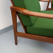 Pair of vintage Scandinavian armchairs in teak and green fabric from the 1960s.
