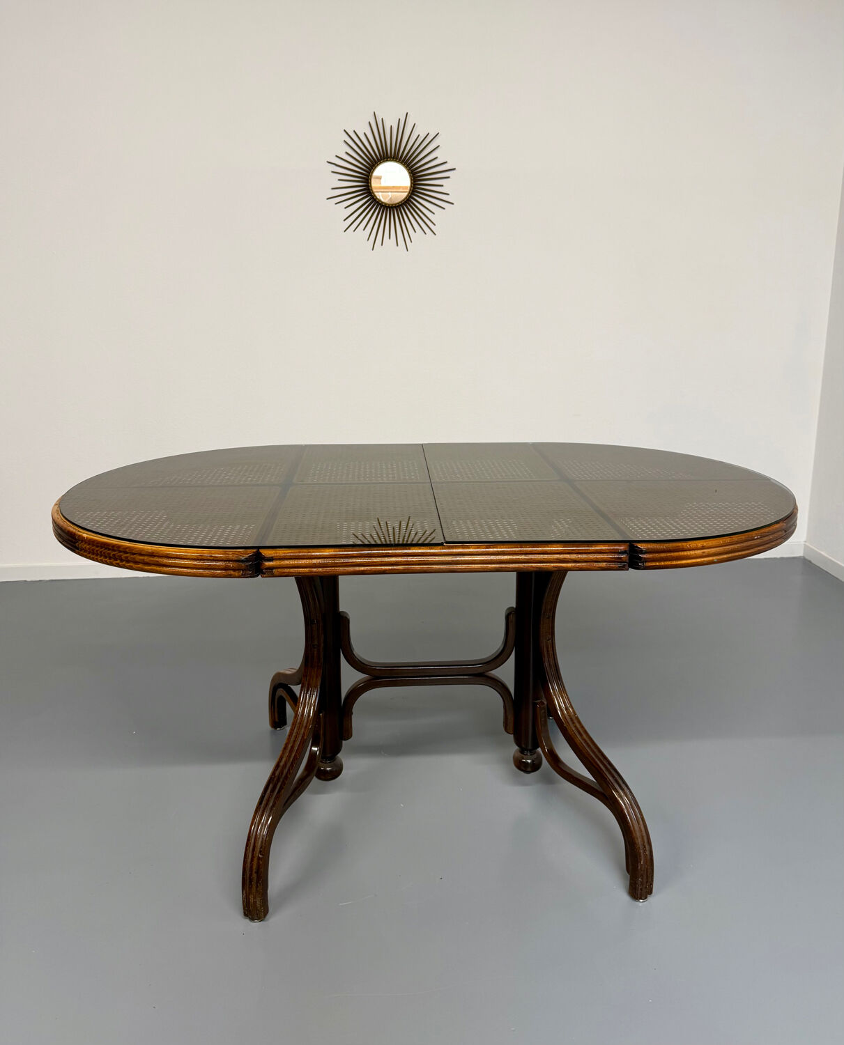 Vintage dining table with a cane top by Mundus from the 1970s.