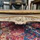 Louis XV style coffee table in carved wood with grey and gold highlights.