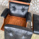 Lounge chair and ottoman black leather and teak multiplex, 1960