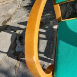 3 vintage bridge chairs with rounded armrests.