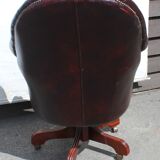 Oxblood leather bucket chair revolving