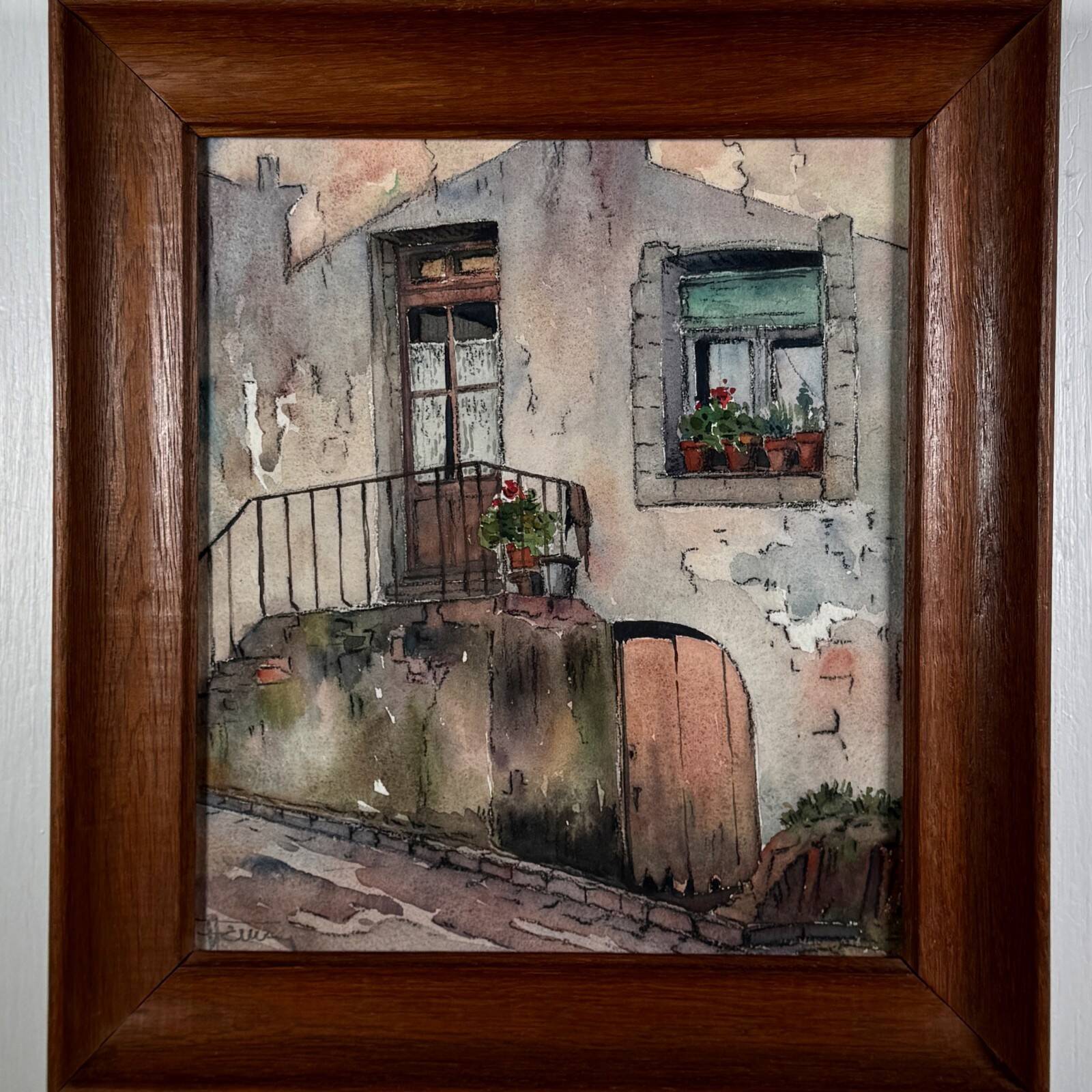 Watercolour on paper depicting the entrance of a house from the early 20th century.