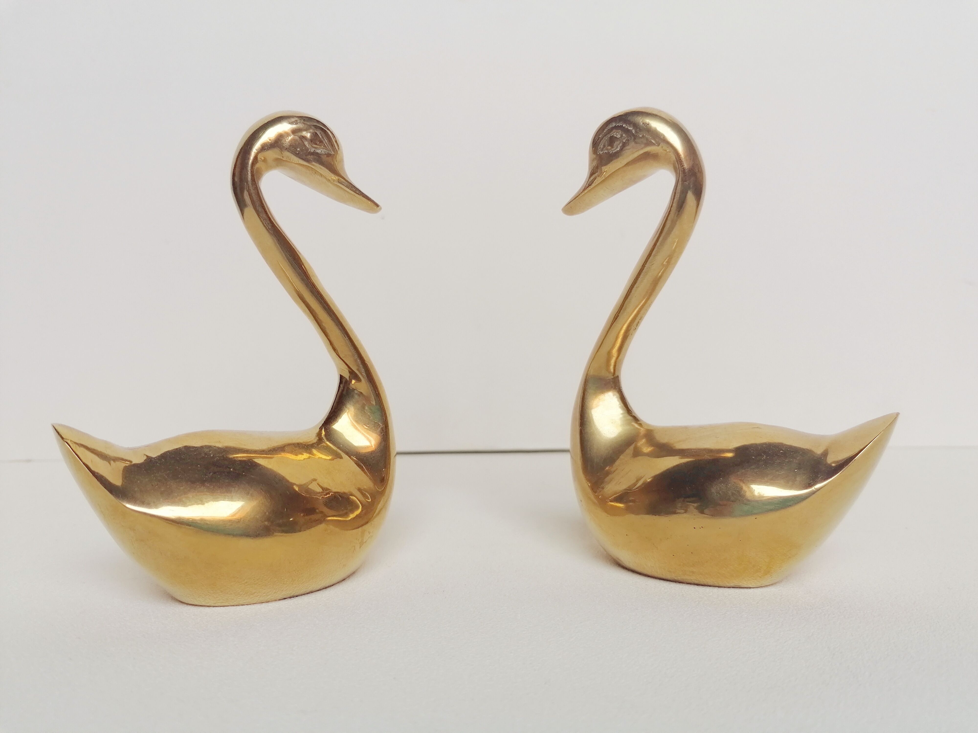 Two ducks made of solid brass
