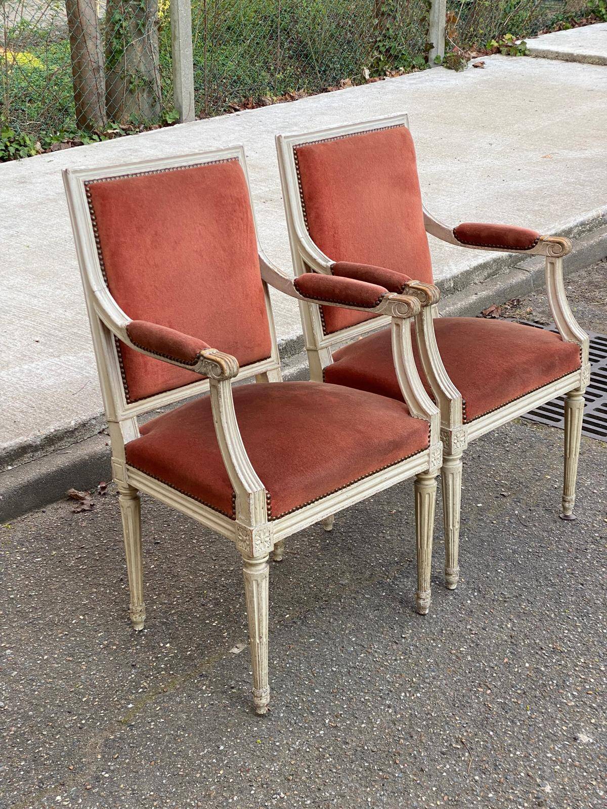 2 Louis XVI armchairs in solid wood and orange velvet.