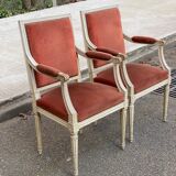 2 Louis XVI armchairs in solid wood and orange velvet.