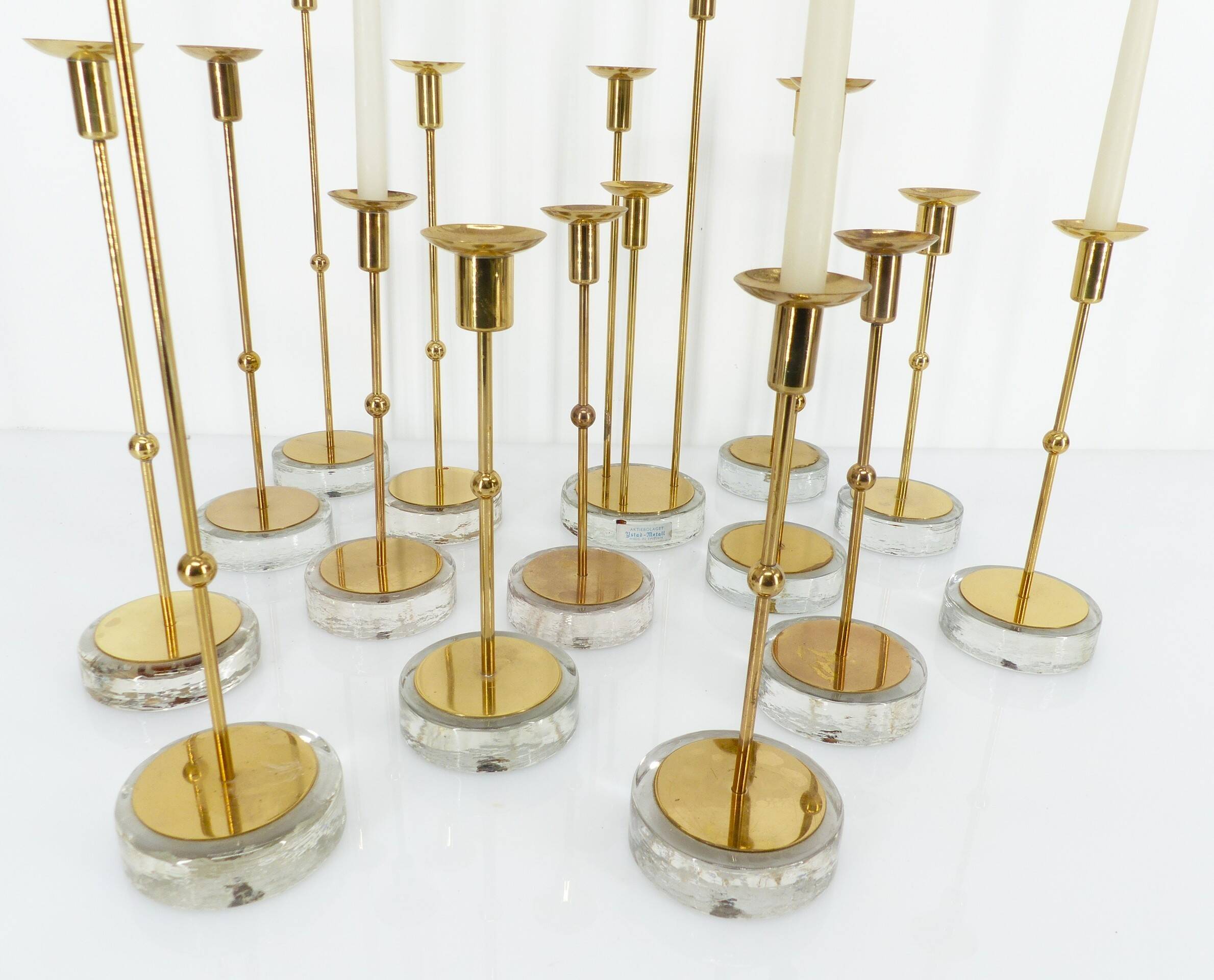 Set of 15 Scandinavian candle holders in brass and glass, Gunnar Ander, Ystad Met