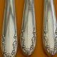 Set of 12 cheese or fruit knives handle in silver metal.