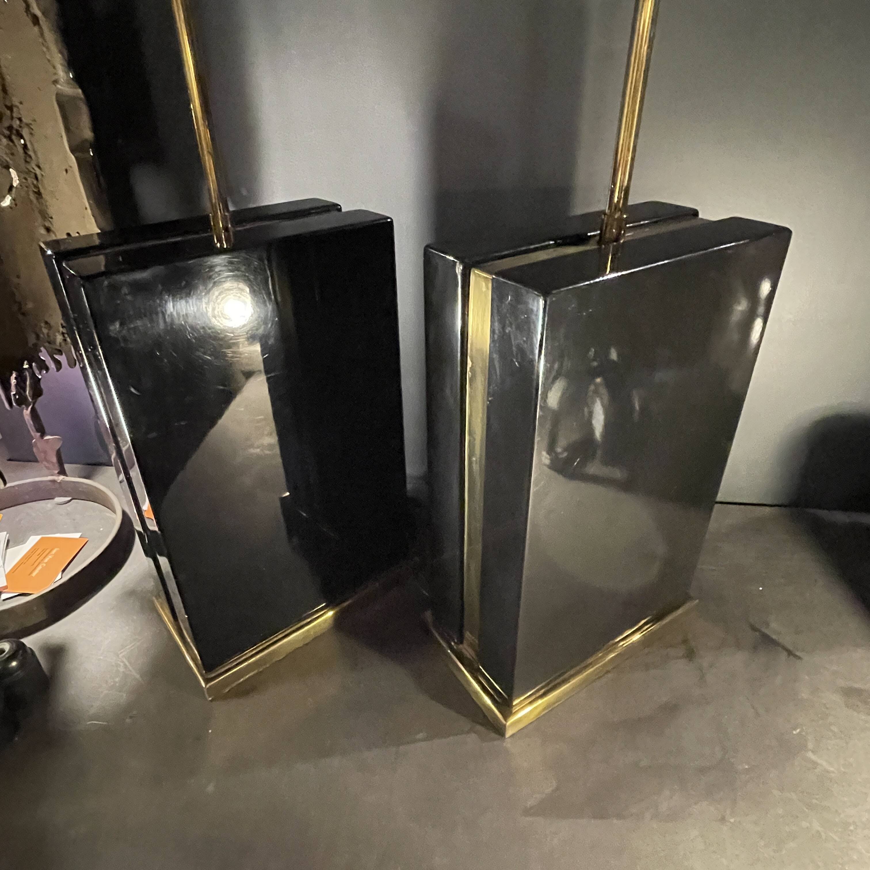 Pair of black lacquered and brass table lamps, circa 1970