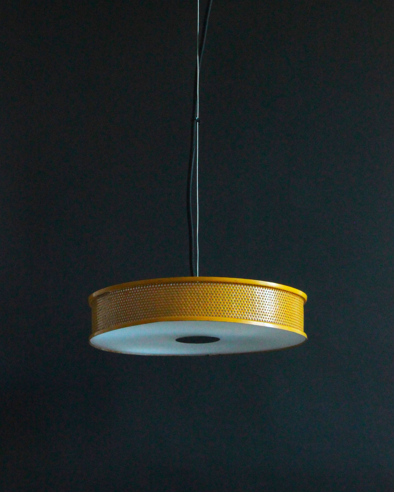 Yellow lacquered perforated metal pendant, in the style of Matégot or Biny.