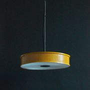 Yellow lacquered perforated metal pendant, in the style of Matégot or Biny.