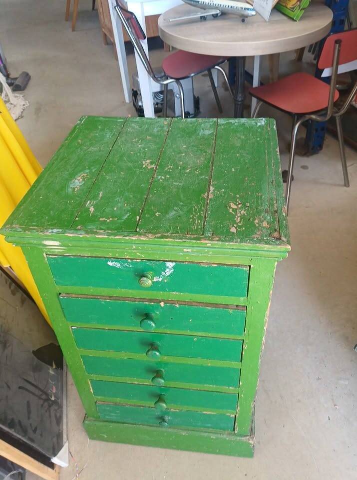 Vintage workshop furniture with 6 green drawers.