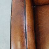 Art Deco design sheepskin leather armchair with a stunning patina