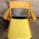 Fauteuil bridge skaï jaune et bois