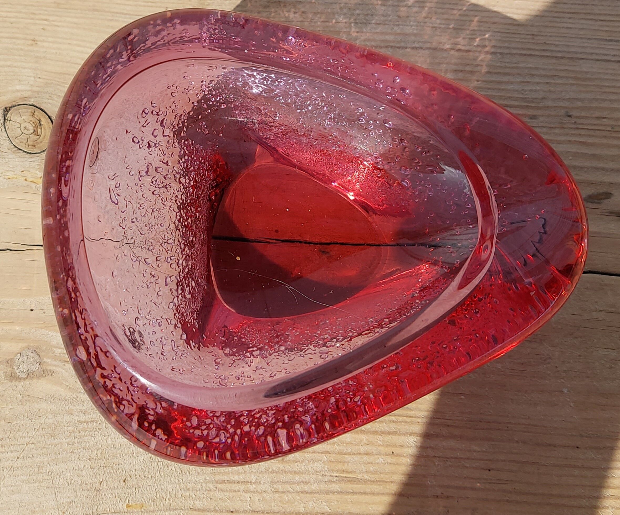 Empty pink blown glass pocket