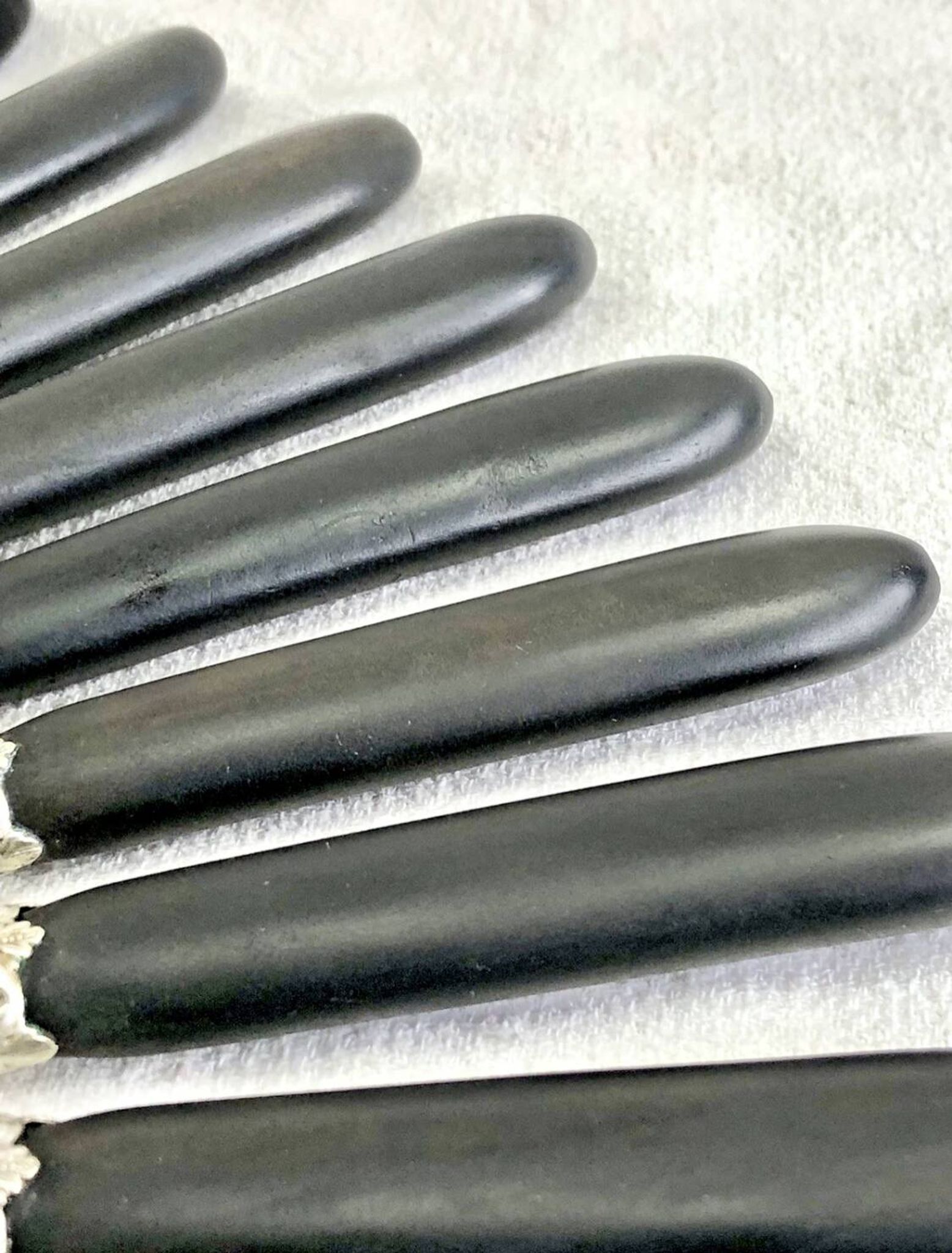 12 antique large table knives with ebony handles from the Napoleonic III period.