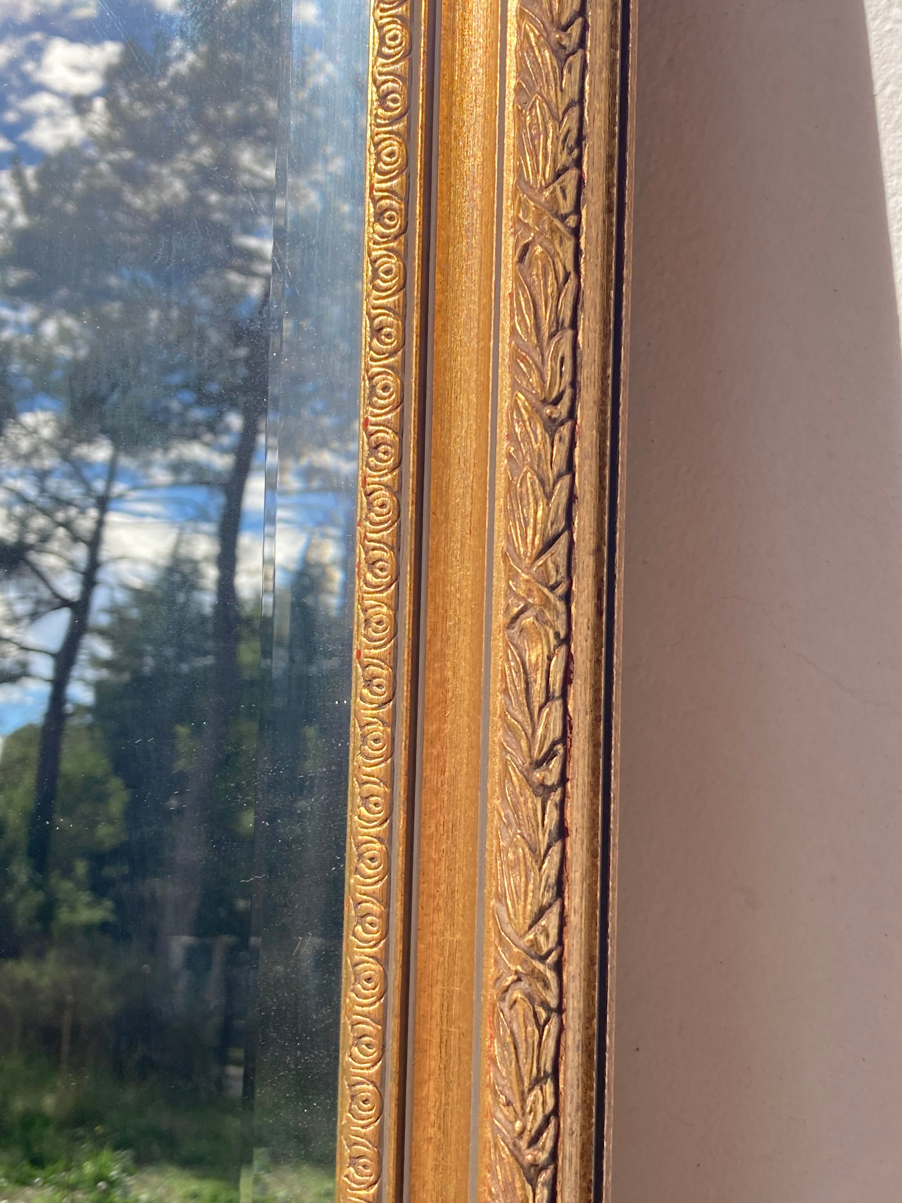 Antique mirror in rectangular beveled gilded wood in Louis XVI style