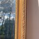 Antique mirror in rectangular beveled gilded wood in Louis XVI style
