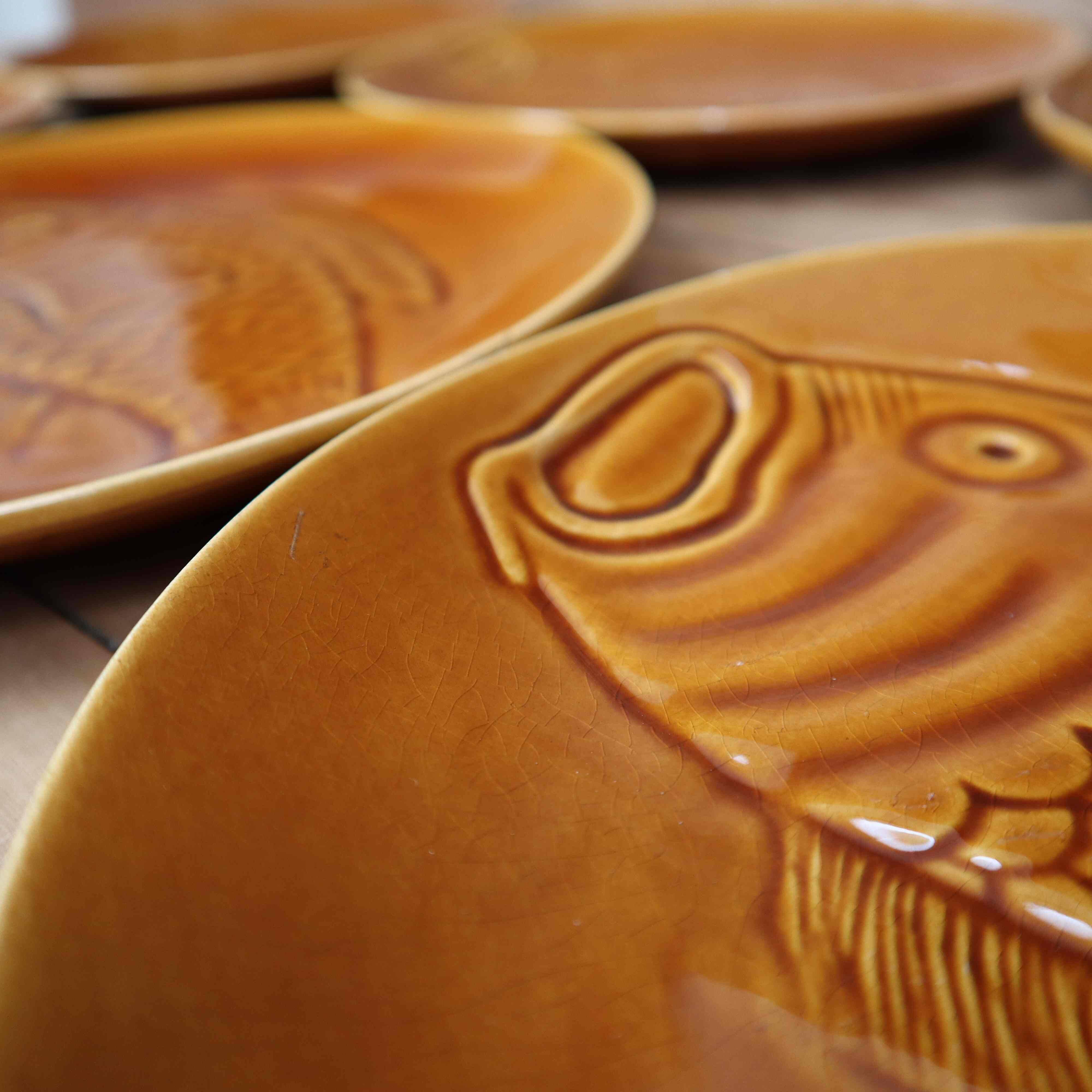 8 glazed flat plates with vintage fish decoration Saint Amand
